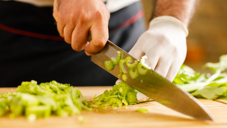 Chef slicing celery