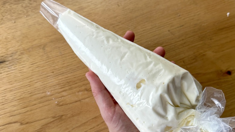 Cream cheese frosting in a piping bag