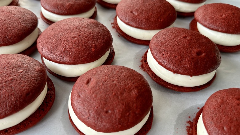 Red velvet whoopie pies on baking sheet