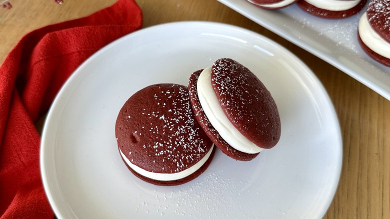 Red velvet whoopie pies on plate