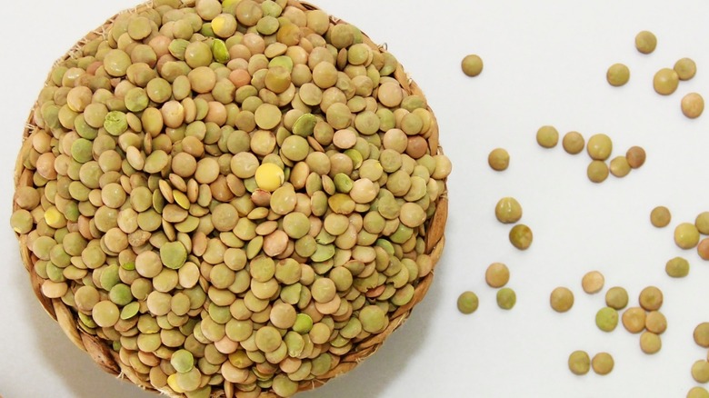 Dry green lentils in a basket