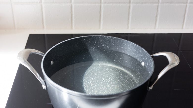 water in pot on stove