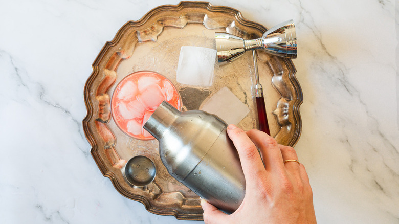 pouring cocktail into glass