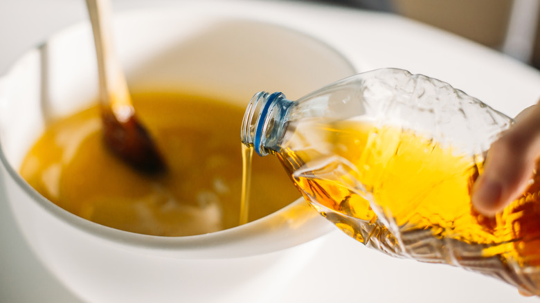 Cooking oil pouring into bowl