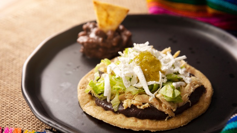 sope with refried beans and chicken