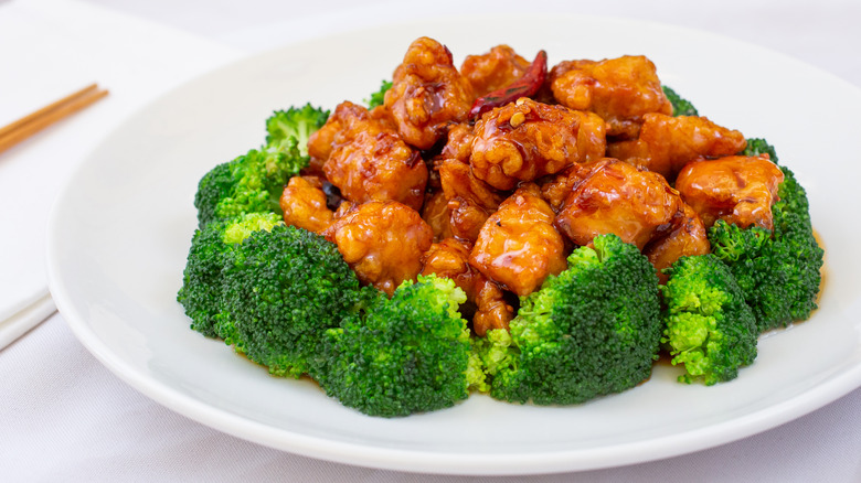 General Tso's chicken on a plate in a restaurant