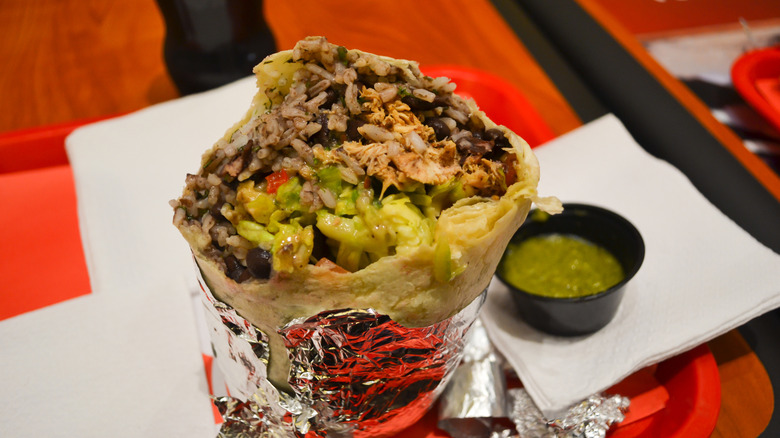 Burrito wrapped in foil with guac