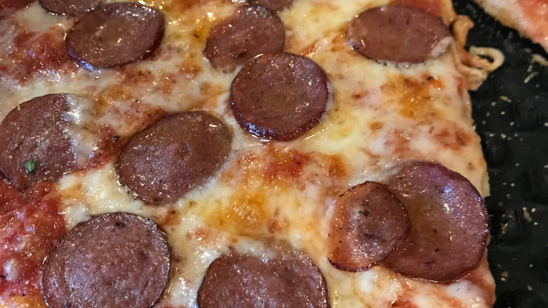 reindeer sausage pizza slice