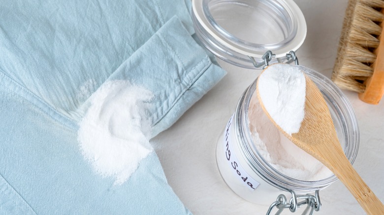 applying baking soda to a shirt