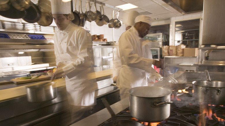 cooks in restaurant kitchen