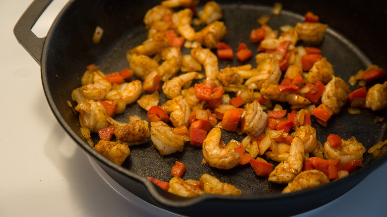 shrimp and peppers in pan 