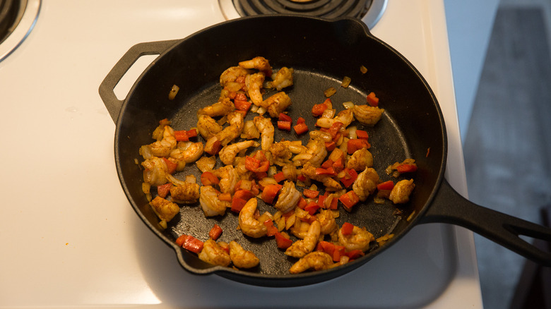 shrimp cooking in iron pan 