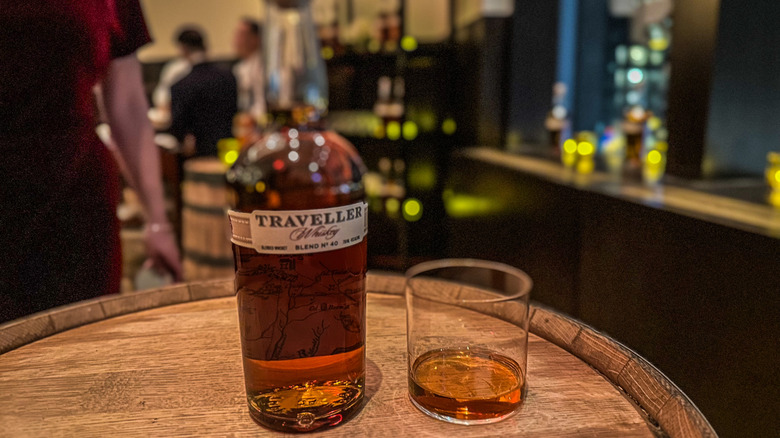 Traveller and glass of whiskey