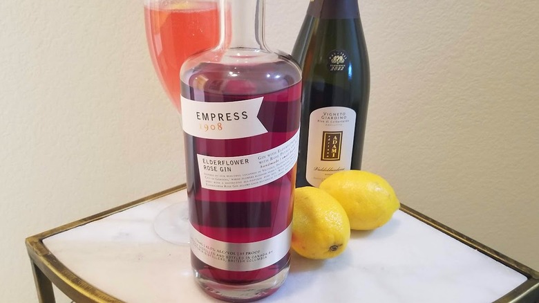 Empress 1908 bottle with French 75 cocktail