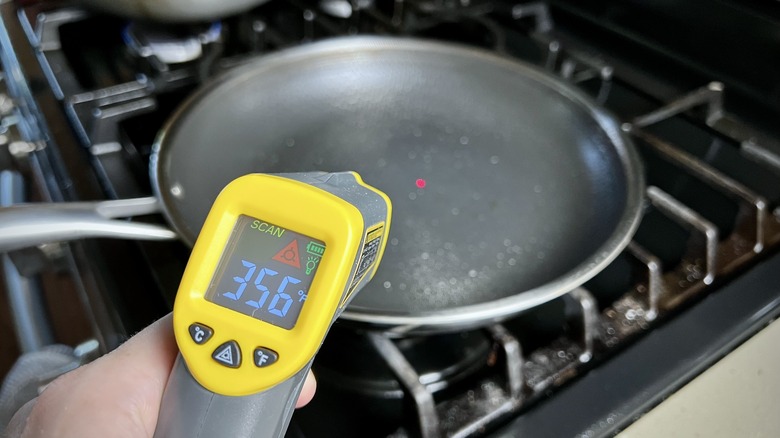 Infrared thermometer measuring pan temperature