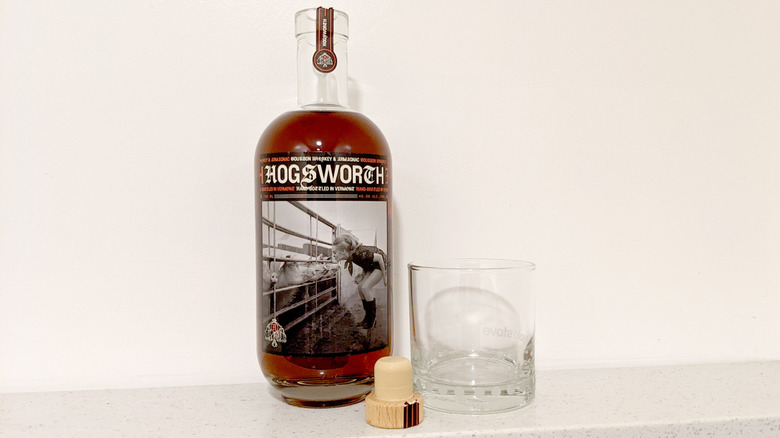 Hogsworth bottle uncorked with glass