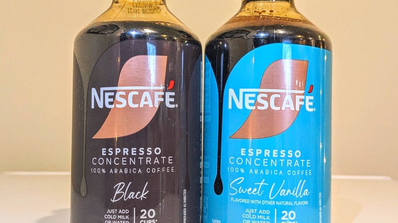 Close-up of Black and Sweet Vanilla Nescafé espresso concentrate bottles.