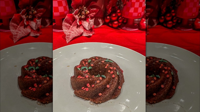 Dark Toffee Bundt on a white plate with holiday decorations