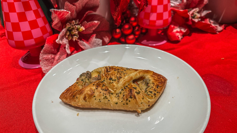 Turkey Sage Danish on a white plate with holiday decorations