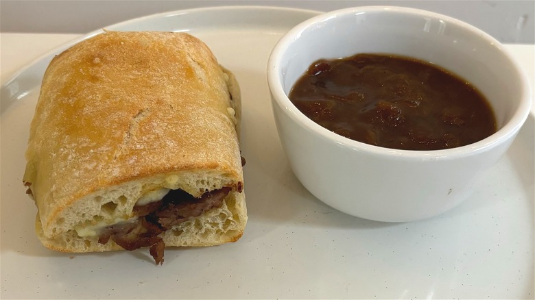 panera french ciabatta dipper next to bowl of french onion soup on table