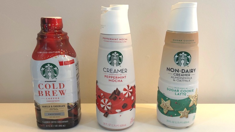 Starbucks cold brew concentrate, peppermint mocha creamer, non-dairy sugar cookie latte creamer on white background