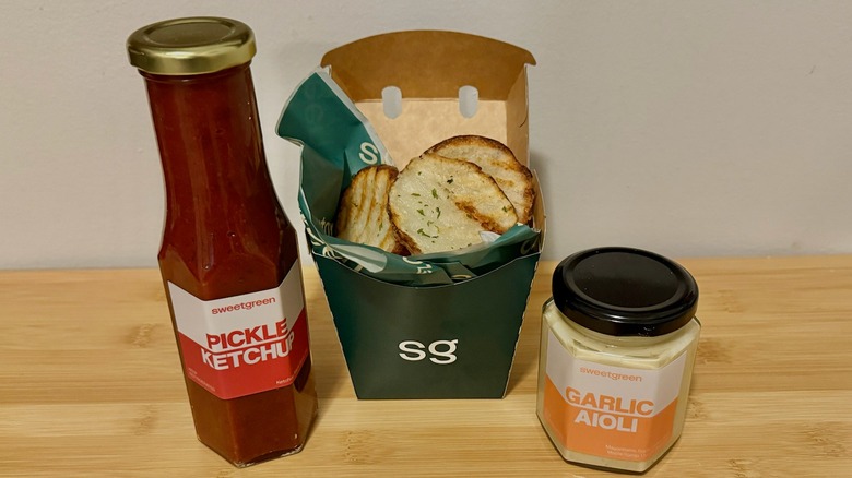 Sweetgreen pickle ketchup, ripple fries, and garlic aioli on display