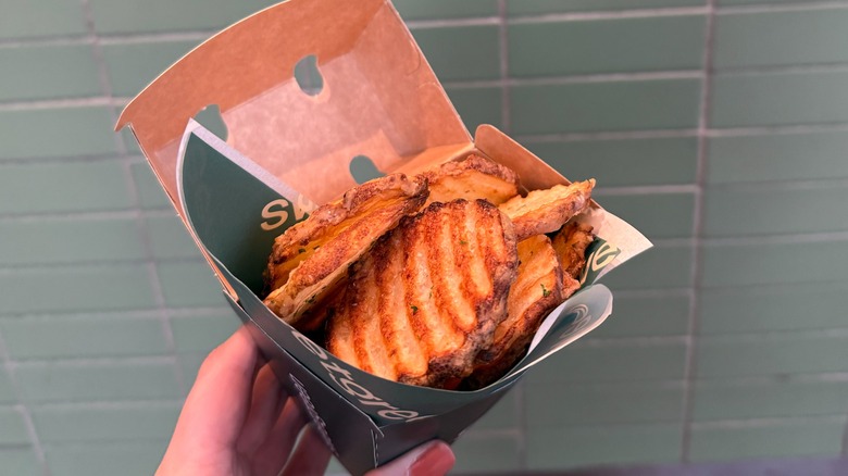 Sweetgreen fries up close being held in their container
