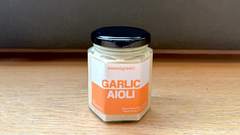 bottle of garlic aioli from Sweetgreen sitting on a counter