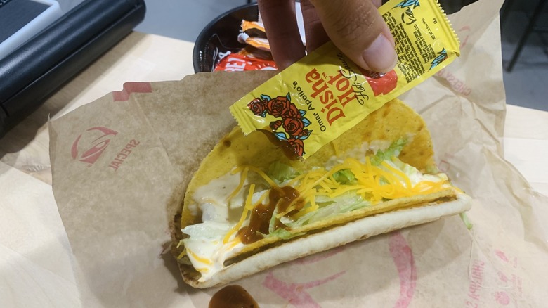 Taco Bell Disha Hot sauce on gordita