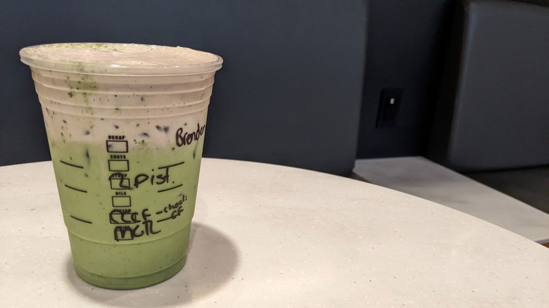 The same Starbucks takeout cup with the Dubai chocolate matcha latte, showing ingredients checkboxes.