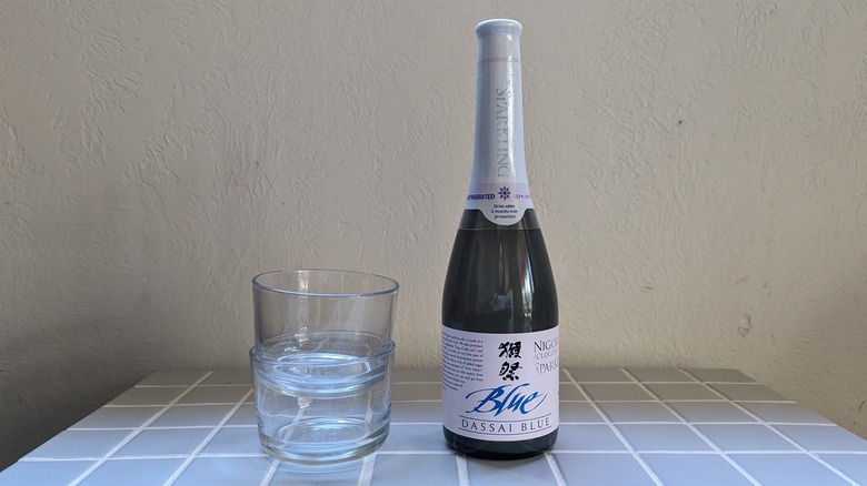 bottle of sake with glasses