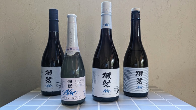 Four bottles of Dassai Blue sake