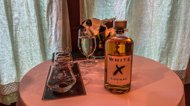 White X Cognac bottle, glasses