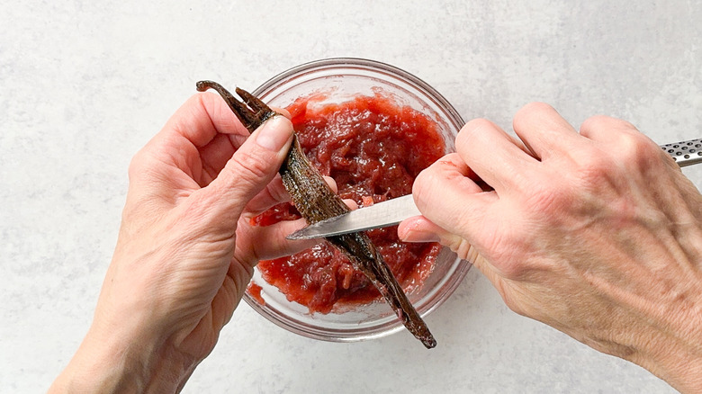 Scraping vanilla bean seeds out of pod with knife