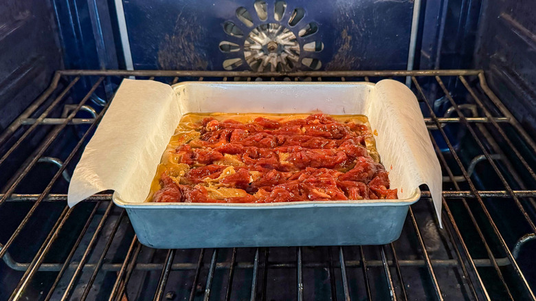 Rhubarb and white chocolate blondies baking in oven