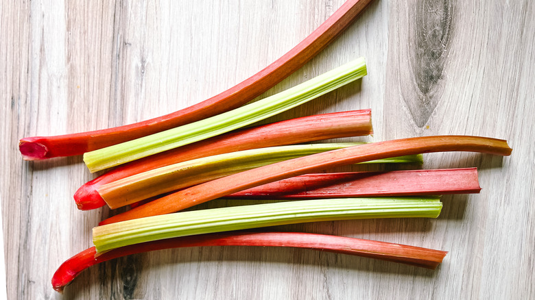 Fresh rhubarb stalks on table top