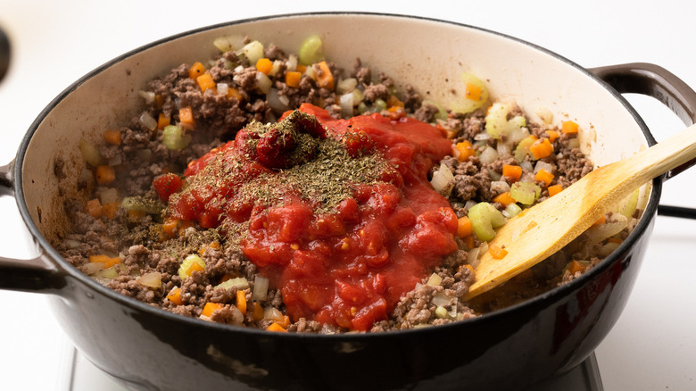 unstirred ground beef stew in pot