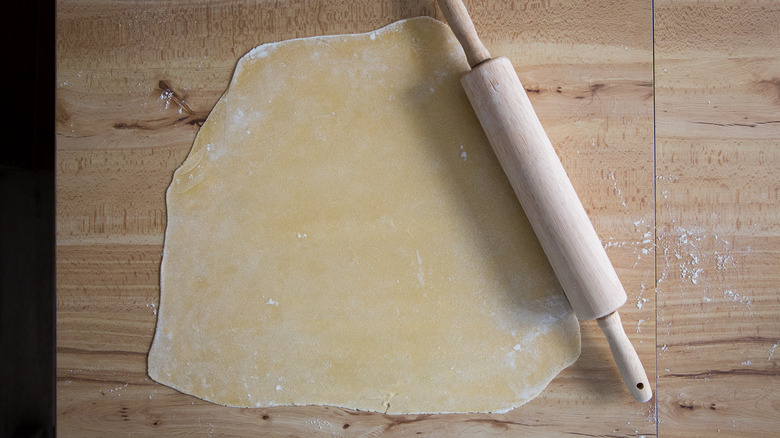 Rolled ravioli dough on table