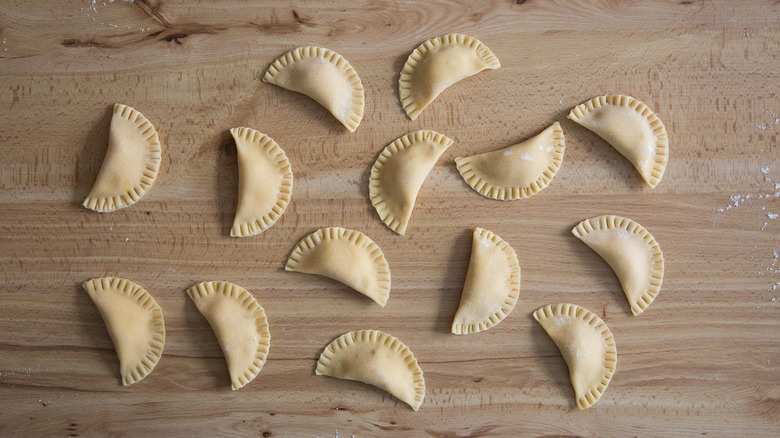 uncooked ravioli sitting on table