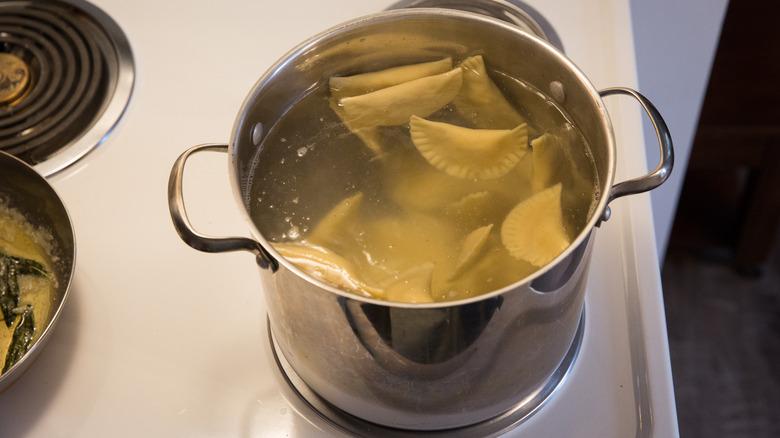 ravioli cooking in large pot