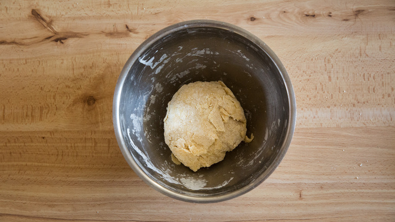 dough ball in metal bowl