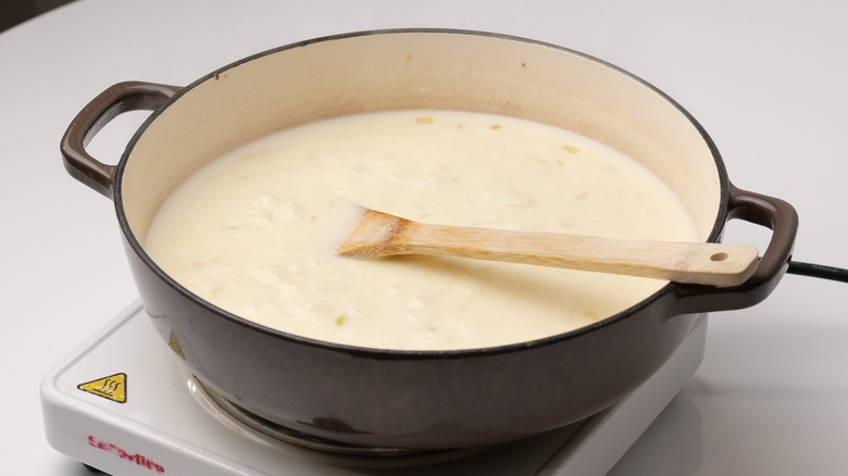 creamy soup simmering in pan