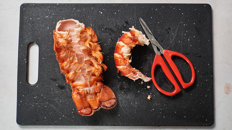 lobster tails on cutting board