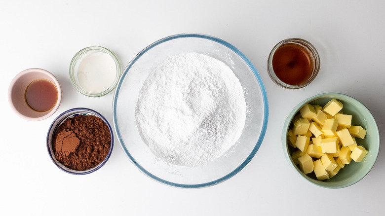 Ingredients for chocolate frosting in bowls 