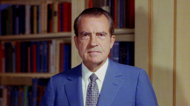 Richard Nixon in front of a bookcase