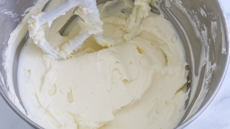 cream cheese and sugar combined in the bowl of a stand mixer