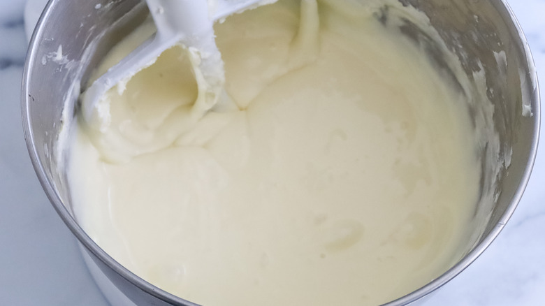 cream cheese, sugar and eggs in a stand mixer bowl