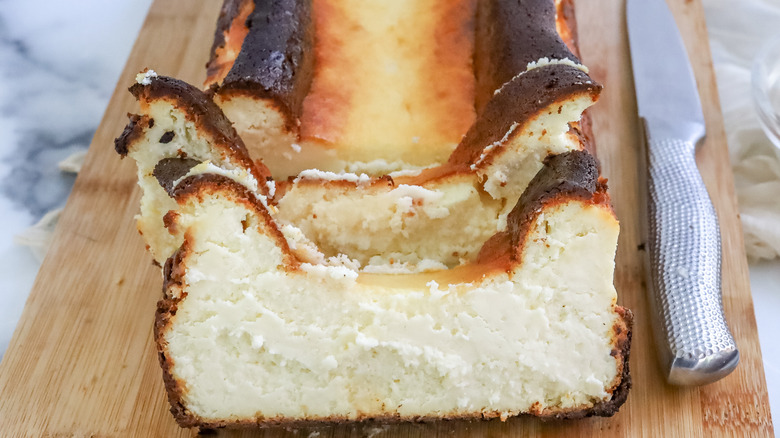 Slices of richest loaf pan Basque cheesecake on a cutting board