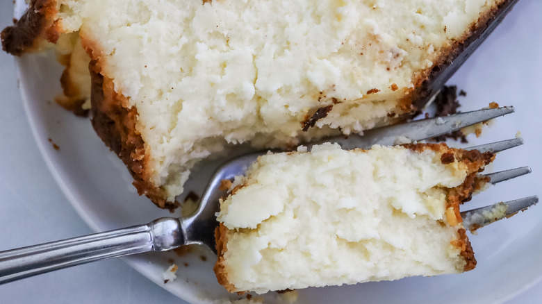 close up on a forkful of creamy rich Basque cheesecake