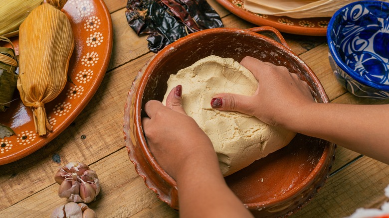 making masa for tamales